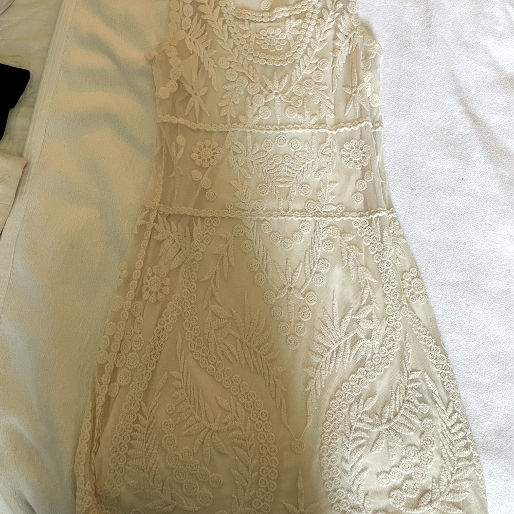 Express crème colored dress with subtle floral embroidery